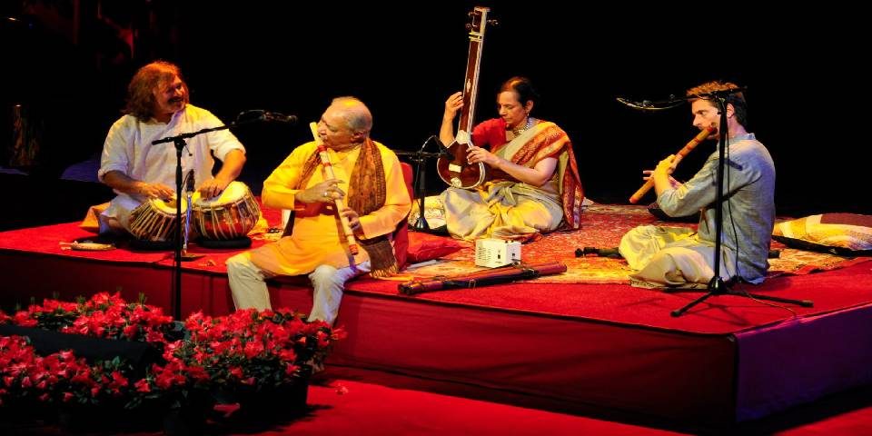 Image That Resembles Four Musical Artists Performing in Musical Concert.