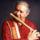 Great Indian Legend Playing Wooden Flute In A Black Background.