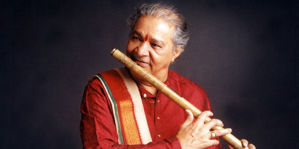 Great Indian Legend Playing Wooden Flute In A Black Background.