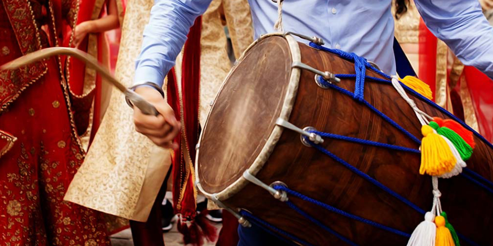 A Folk Singer Plays His Instrument In A Roadside Drama.