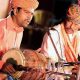 Indian Folk Singers Singing Folk Songs While Playing Their Instruments.