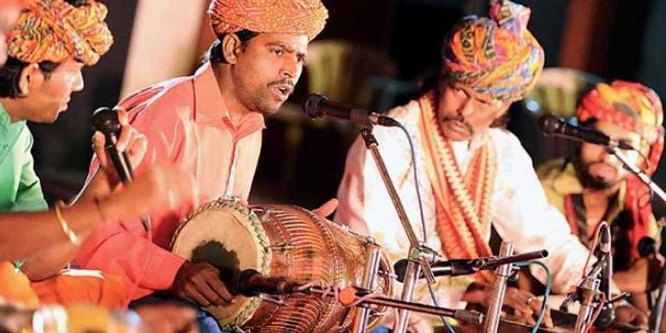 Indian Folk Singers Singing Folk Songs While Playing Their Instruments.