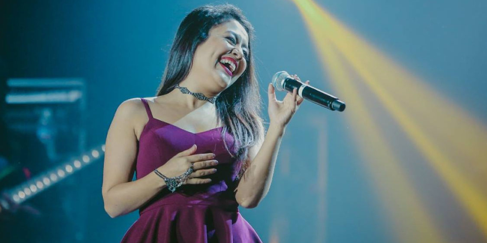 A Smiling Indian Famous Pop Singer Performing In A Concert.