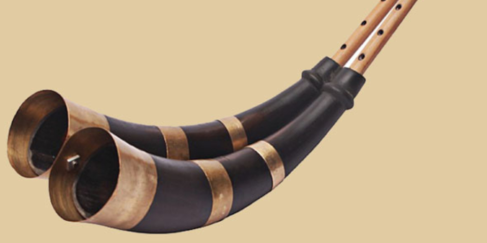 A Folk Musical Instrument Isolated On A Brown Background.