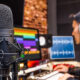 Sound engineer working at mixing panel in the boutique recording studio.